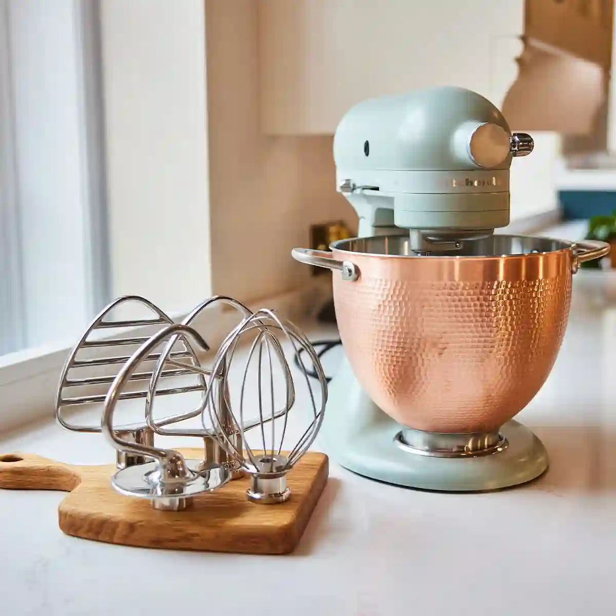 KitchenAid Blossom Artisan stand mixer lifestyle image with accessories